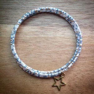Beaded memory wire bracelet - white, gold and blue/grey seed beads and gold star pendant